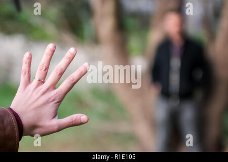 Engagement Photos, rings visible on the hands in the nature. focused rings. blurred background. Stock Photo