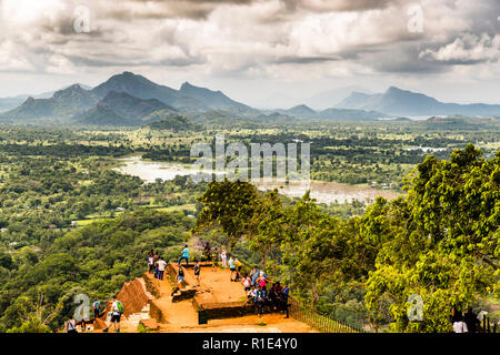 Breathtaking view from the Sigiriya rock fortress over rice fields and mountain ranges in the distance Stock Photo