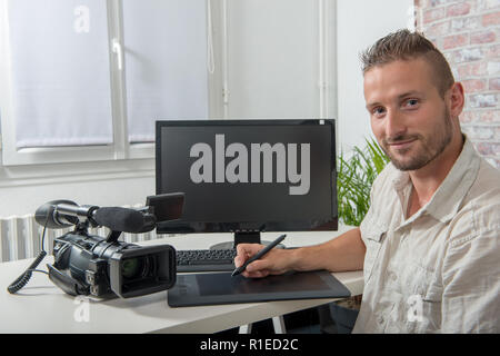 man video editor using a graphic tablet Stock Photo