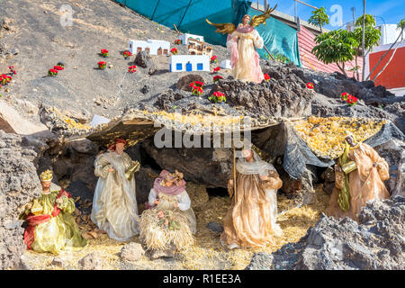 Christmas Nativity scene showing the cave with the baby Jesus, Mary and Joseph in Lanzarote. Stock Photo