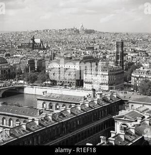 1950s, historical, a view across Paris, France and the famous monument of Sacre-Coeur on the skyline in the far distance. Stock Photo
