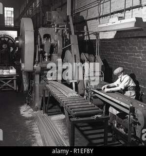 1950s, Ever Ready battery factory, male worker standing on the factory ...