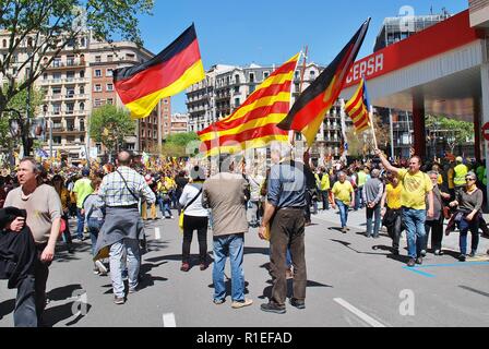 Catalans wave flags during a Llibertat Presos Politics (Free Political Prisoners) march in central Barcelona, Spain on April 15, 2018. Stock Photo