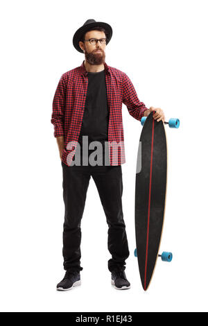 Full length portrait of a male hipster standing and holding a longboard isolated on white background Stock Photo