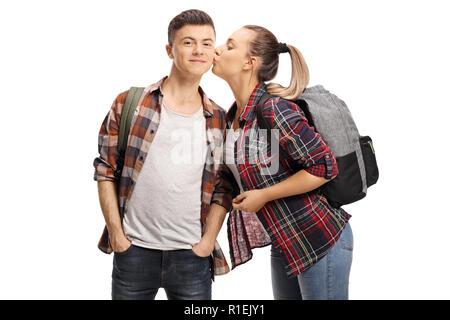 Teenage girl kissing a teenage boy isolated on white background Stock Photo