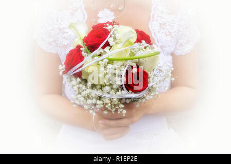 Close-up of a wedding bouquet of red flowers held by the bride. Stock Photo