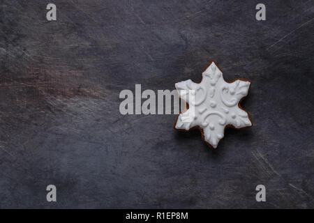 Gingerbread cookies snowflake on dark background, copyspace Stock Photo