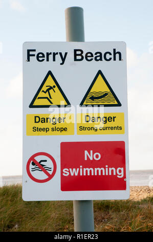 Beach warning sign for swimming and strong currents at Fleetwood Lancashire England UK Stock Photo