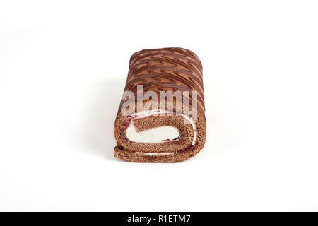 Chocolate biscuit roll cake isolated on white background. Stock Photo