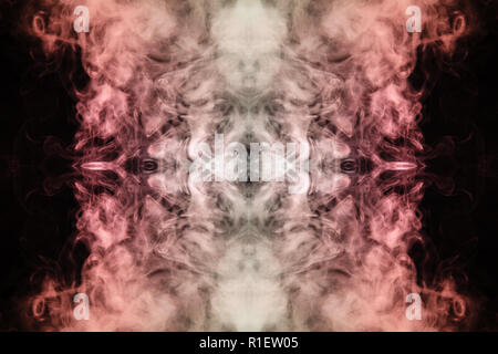 Abstract thick colored smoke orange and pink colour on a black background with a monster face. The concept of a light laser show at a musical concert  Stock Photo