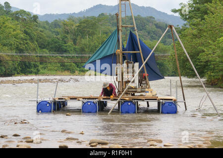 Kiulu Sabah Malaysia - Nov 21, 2017 : Geotechnical investigations workers performing test for bridge construction at Kiulu river. Kiulu is among touri Stock Photo
