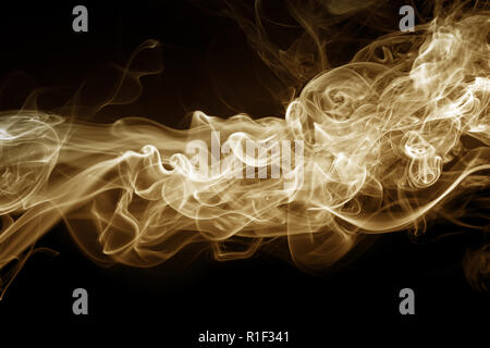 yellow smoke abstract on black background, fire design Stock Photo