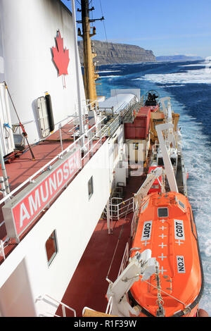 Canadaian Coast Guard Ship Amundsen steaming along Lancaster Sound beside Devon Island, Eastern Arctic Stock Photo