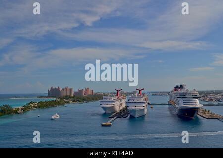 Nassau, Bahamas - January 11, 2015: View of cruise ships in the port of Nassau and the Atlantis Resort on Paradise Island in the Bahamas Stock Photo