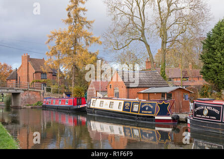 Colorfull narrowboats at Tom o the Wood on the Grand Union Canal near Lapworth, Warwickshire, England, UK Stock Photo