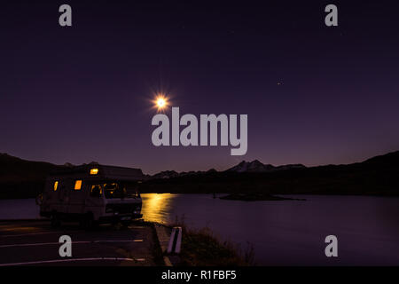 Mobile homes at night in the swiss alps Stock Photo