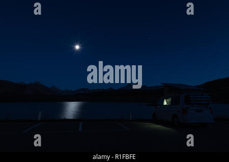 Mobile homes at night in the swiss alps Stock Photo