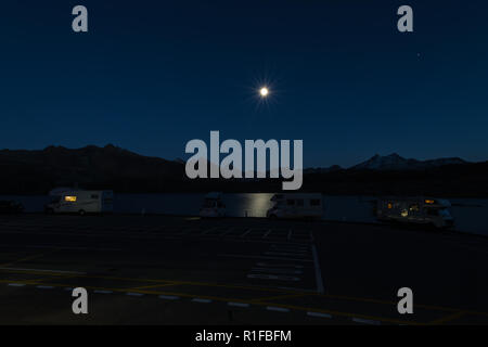 Mobile homes at night in the swiss alps Stock Photo