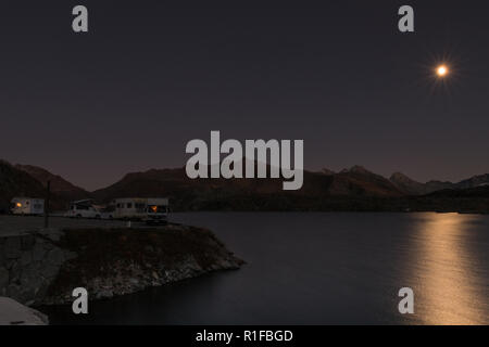 Mobile homes at night in the swiss alps Stock Photo