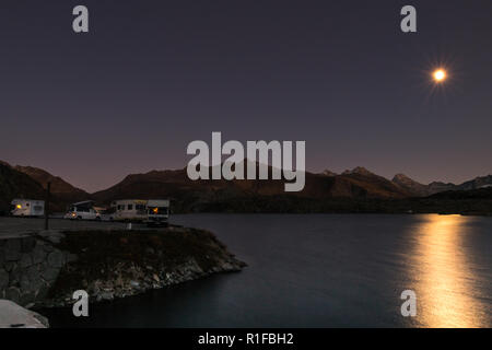 Mobile homes at night in the swiss alps Stock Photo