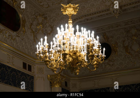 Chandelier with candles in the castle. Stock Photo