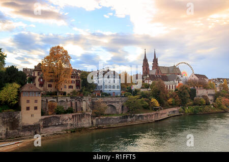 Basel Munster in the river Rhine, at the autumn fair with the ferris wheel in Switzerland