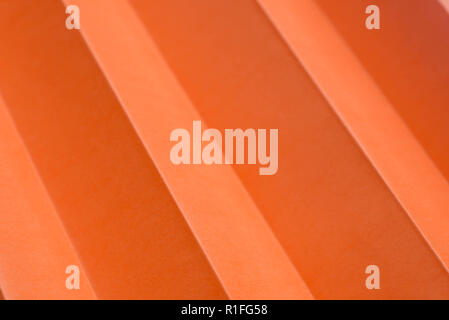 orange sheet of paper folded background texture Stock Photo