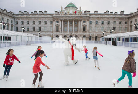 Somerset House, London, UK. 12 November, 2018. Somerset House’s festive ice rink opens with the official Snoopy joining six young and talented ice skaters on Skate at Somerset House with Fortnum & Mason 2018 for an inaugural run. Credit: Malcolm Park/Alamy Live News. Stock Photo