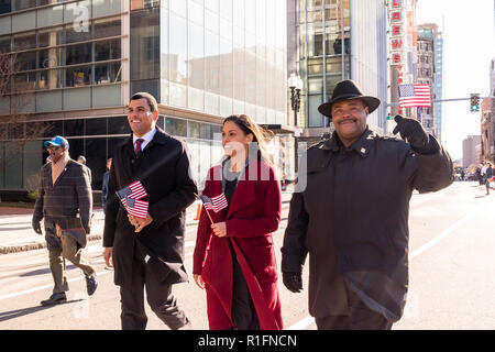 Boston, Massachusetts, USA. 11th November, 2018. William Gross (Boston Police Commissioner) , Giselle Sterling (Commissioner, City of Boston Veterans' Services), and Francisco Urena (Massachusetts Secretary of Veterans' Affairs) walking in the 2018 Boston Veterans' Day Parade. Maia Kennedy/Alamy Live News Stock Photo