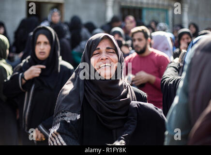 Gaza, Palestine. 12th Nov 2018. Relatives of Palestinian Mostafa Hassan Abu Odeh, who was killed in an Israeli air strike, mourn during his funeral, in Khan Younis. Credit: SOPA Images Limited/Alamy Live News Stock Photo