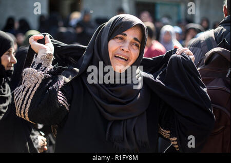 Gaza, Palestine. 12th Nov 2018. Relatives of Palestinian Mostafa Hassan Abu Odeh, who was killed in an Israeli air strike, mourn during his funeral, in Khan Younis. Credit: SOPA Images Limited/Alamy Live News Stock Photo