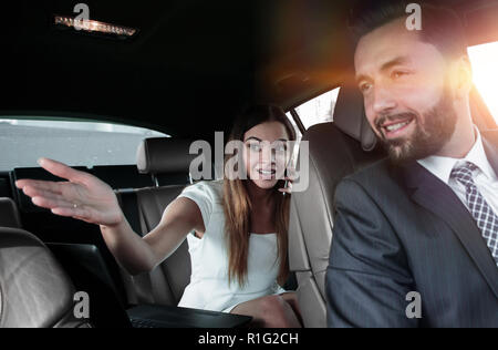 Side view of pretty couple in car. cropped image. Stock Photo