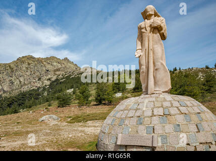 Statue of Christ Roi, Christ the King, pink granite, created by Noel Bonardi in 1984, at mountain pass on road D-84, Col de Vergio, Corsica, France Stock Photo