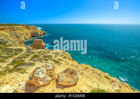 Panorama of Island Rock, a natural limestone in Australian Coral Coast, Kalbarri National Park. Aerial view of turquoise Indian Ocean, sunny day with blue sky. Western Australia Outback. Copy space. Stock Photo