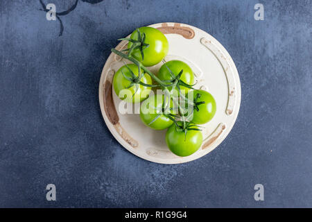 Green Tomatoes on the Vine Stock Photo