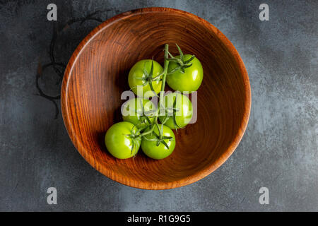 Green Tomatoes on the Vine Stock Photo