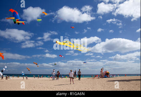 FUERTEVENTURA, SPAIN - NOVEMBER 10: Visitors enjoy beautiful display of flying kites of  at 31th International Kite Festival, November 10, 2018 in Nat Stock Photo