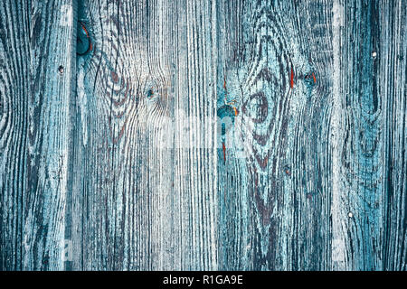 Old wooden wall with peeling paint, background or texture. Stock Photo