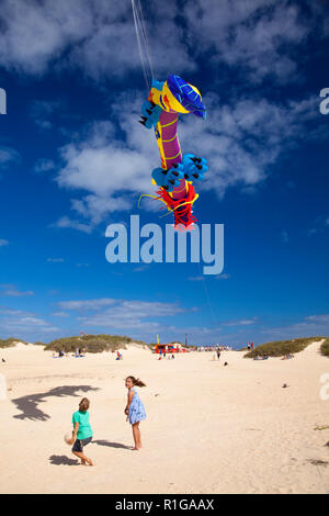 FUERTEVENTURA, SPAIN - NOVEMBER 10: Visitors enjoy beautiful display of flying kites of  at 31th International Kite Festival, November 10, 2018 in Nat Stock Photo