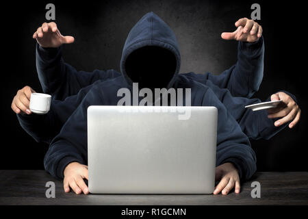 unrecognizable faceless programmer with six hands all a successful workaholic in the workplace Stock Photo