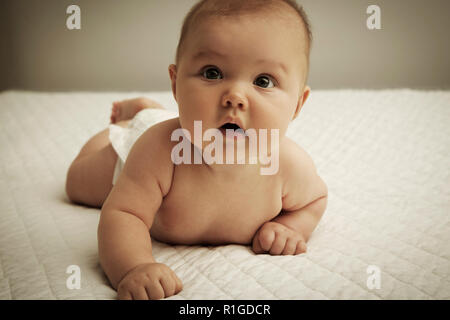 Cute baby lying on belly Stock Photo