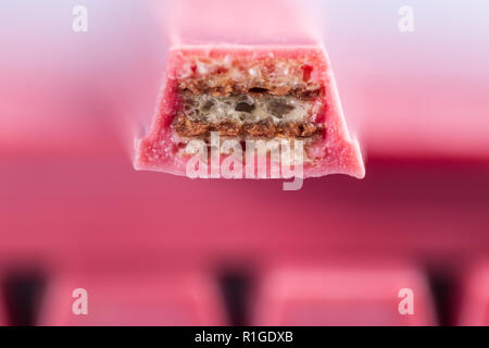 Finger Ruby Chocolate Bar made from ruby cocoa bean. New dimension of chocolate sweets. Stock Photo