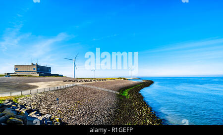 Wind Turbines at the Oosterschelde inlet at the Neeltje Jans island at the Delta Works Storm Surge Barrier in Zeeand Province in the Netherlands Stock Photo
