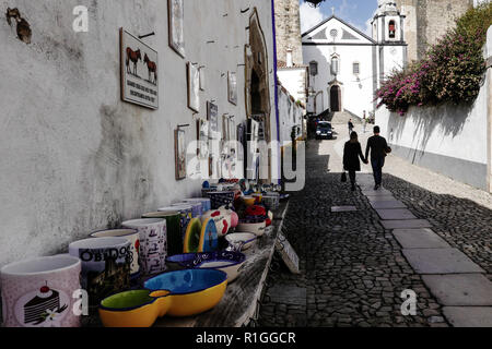 A street scene in Óbidos, a town and municipality in the Oeste Subregion in Portugal with a population of approximately 3100 inhabitants. Stock Photo