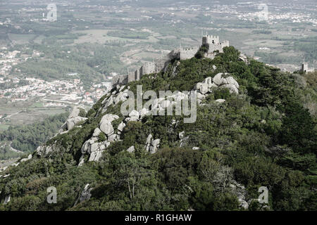 A view of the Castle of the Moors, Castelo dos Mouros, a hilltop medieval castle located in the central Portuguese civil parish of Santa Maria e São M Stock Photo