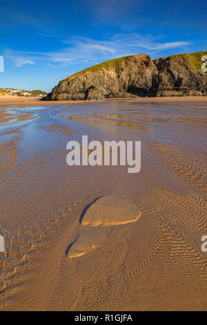 Sand patterns on Perranporth beach, North Cornwall, UK, one looks like a huge footprint. Stock Photo