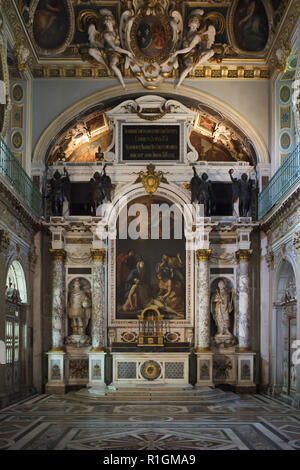 Main altar of the Trinity Chapel in the Palace of Fontainebleau (Château de Fontainebleau) near Paris, France. The chapel was decorated in the 16th century under King Henry IV and King Louis XIII who are depicted on either side of altar, one as Charlemagne the other as Saint Louis. Stock Photo
