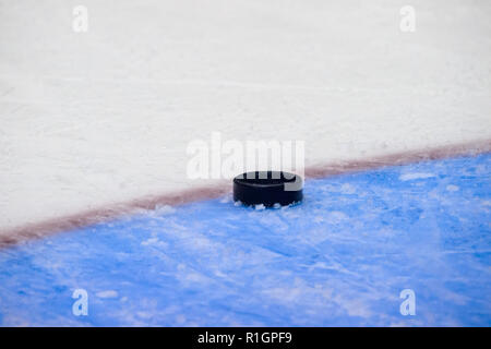 hockey puck sliding on ice