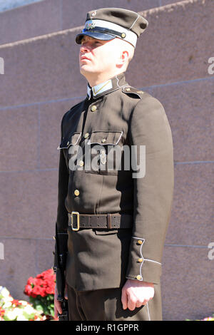 Latvian National Guard soldier in front of the Freedom Monument, Riga