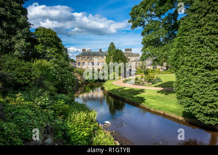 Picturesque view of typical stone buildings in Buxton from the park gardens. Stock Photo